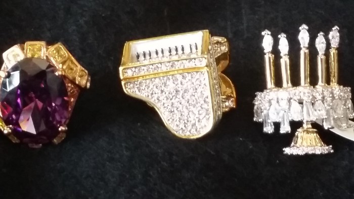 Long discontinued, the rings are cubic zirconium and imitation gemstones on jewelers metals, crafted to a very high level of costume jewelry - so much so they made it into the movie.  The  remaining rings have been held by the Foundation since the 2010 Museum closing, and have become a highly requested collectors item.  